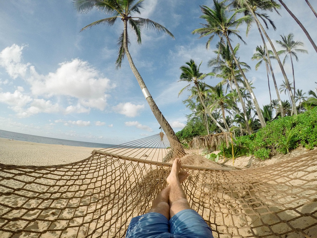 Working remotely in Belize with laptop by the ocean