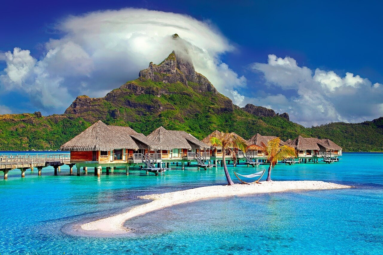 Bora Bora vacation packages featuring turquoise lagoon waters and luxury overwater bungalows
